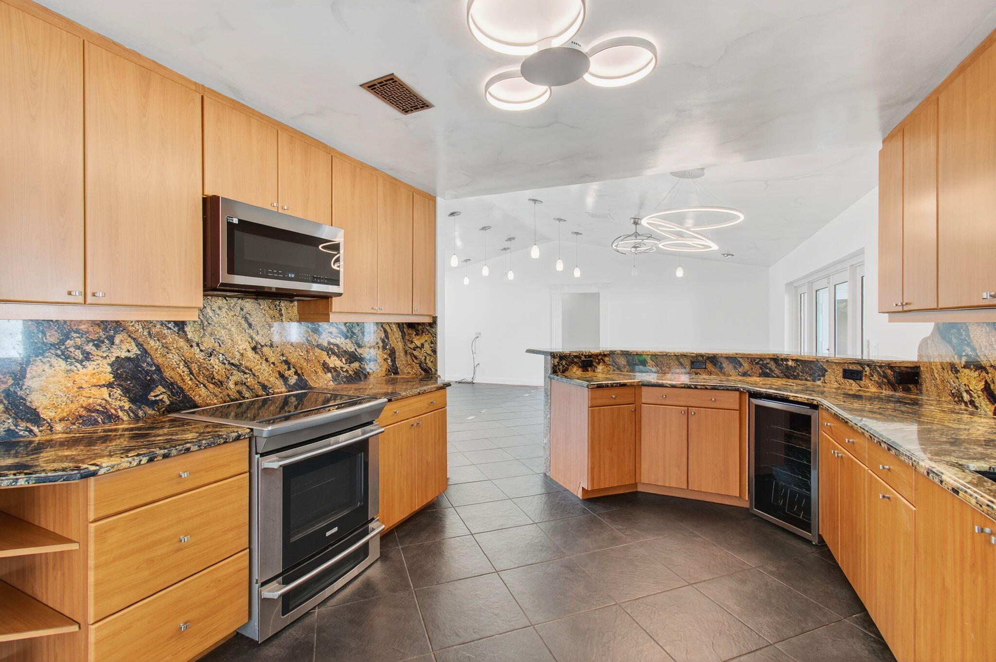 17350 Springtree Lane Boca Raton, FL 33487 - Photo 32 of 83 a kitchen with stainless steel appliances granite countertop a stove and a sink