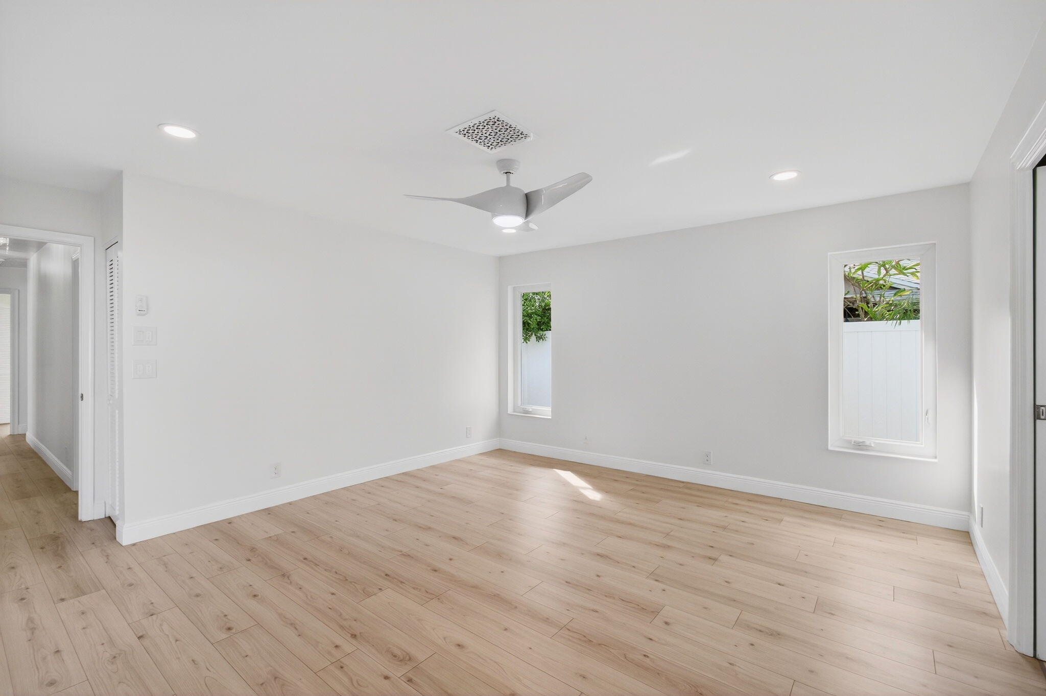 17350 Springtree Lane Boca Raton, FL 33487 - Photo 35 of 83 wooden floor in an empty room with a window