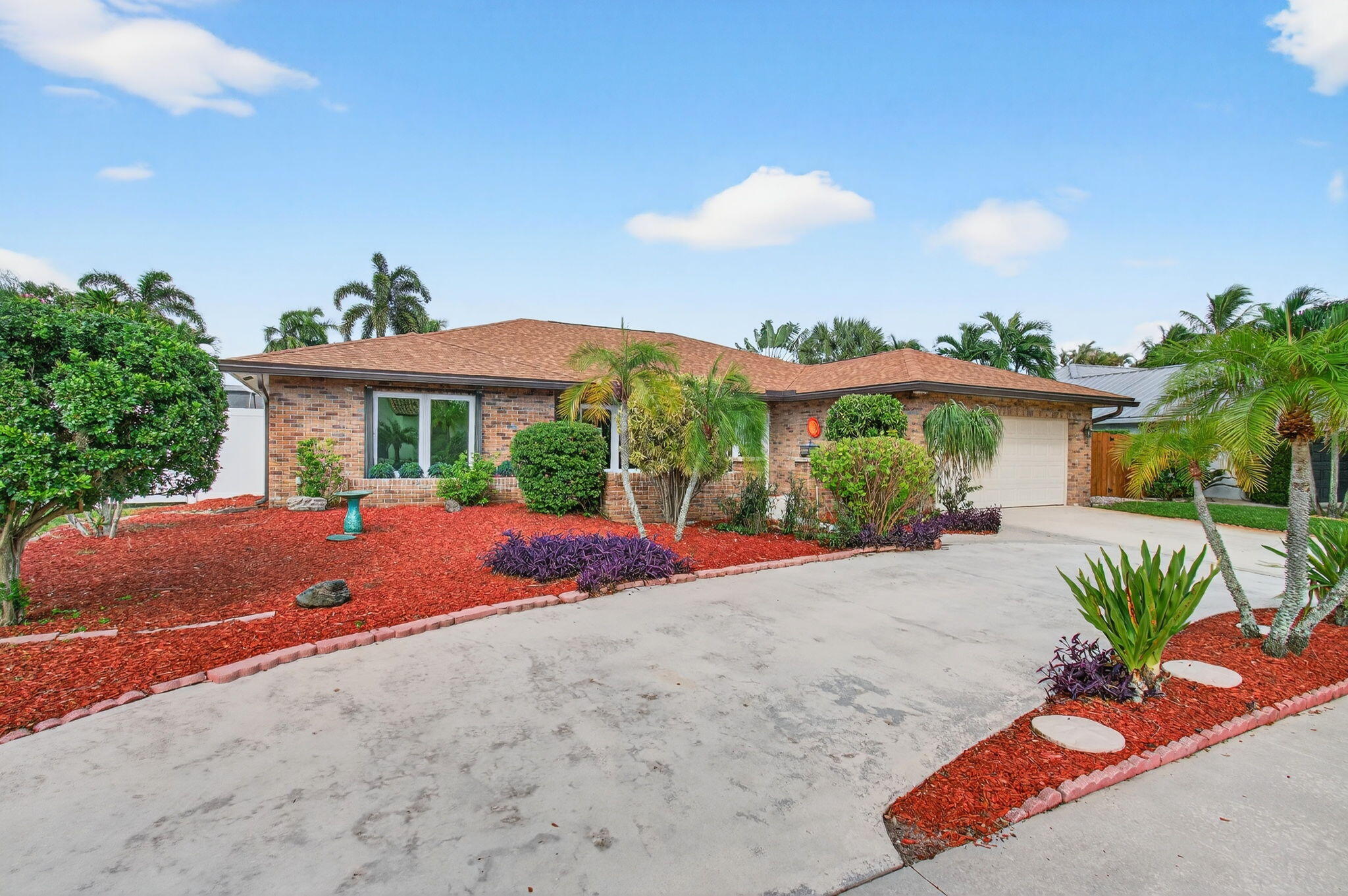 17350 Springtree Lane Boca Raton, FL 33487 - Photo 4 of 83 a view of a house with a yard and potted plants