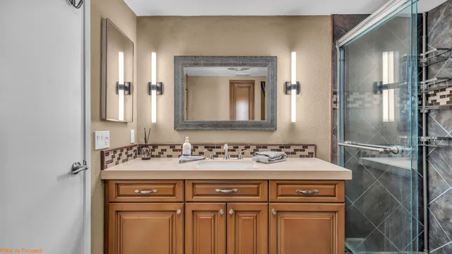 a bathroom with a sink and a mirror