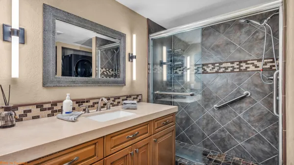 a bathroom with a sink and a mirror
