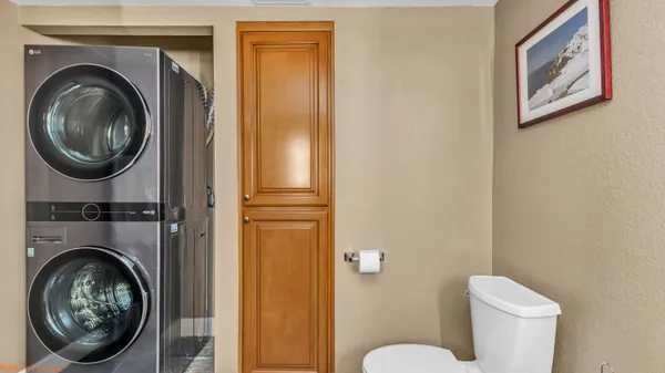 a view of a bedroom with washer and dryer