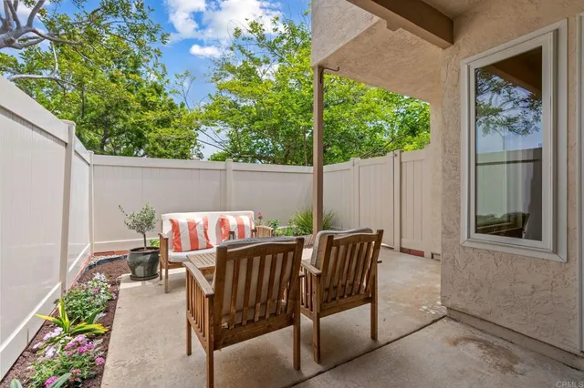 a view of balcony with furniture