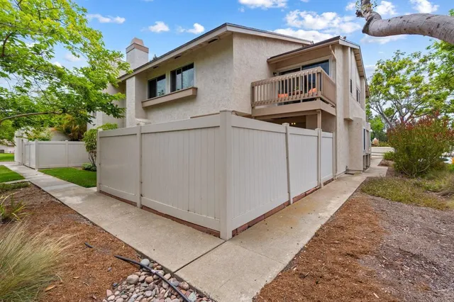 a front view of a house with garage