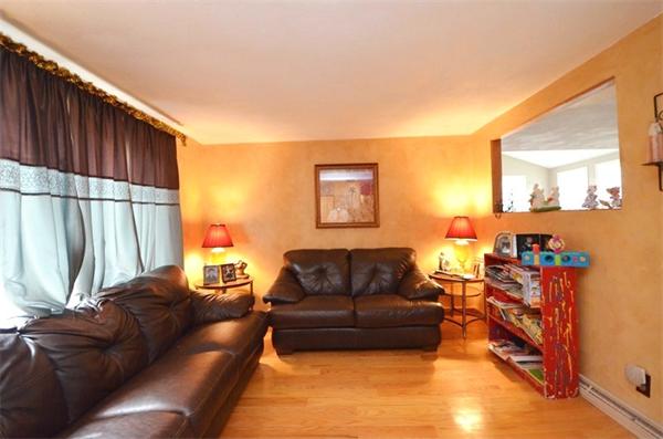 8 Riverside Road Billerica, MA 01821 - Photo 11 of 30 a living room with furniture and a flat screen tv