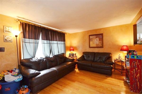 8 Riverside Road Billerica, MA 01821 - Photo 12 of 30 a living room with furniture and a lamp