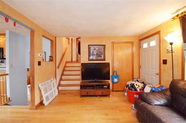 8 Riverside Road Billerica, MA 01821 - Photo 13 of 30 a living room with furniture and a flat screen tv
