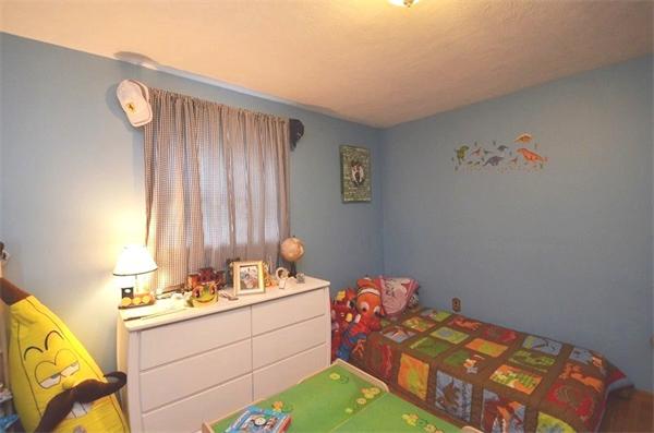 8 Riverside Road Billerica, MA 01821 - Photo 18 of 30 a bed room with a bed and a fish tank