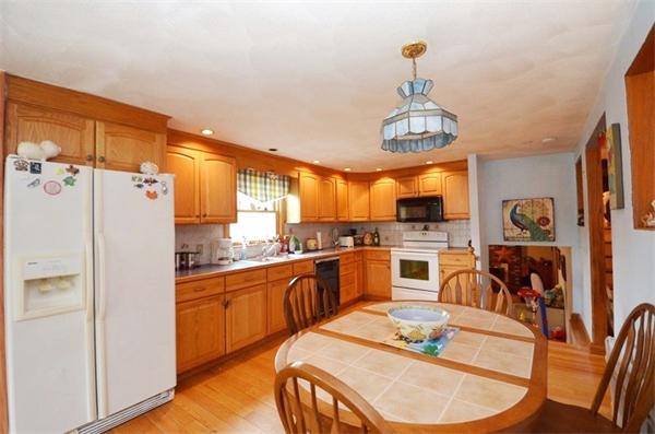 8 Riverside Road Billerica, MA 01821 - Photo 4 of 30 a open kitchen with stainless steel appliances granite countertop a stove and refrigerator