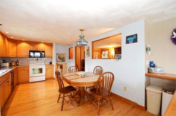 8 Riverside Road Billerica, MA 01821 - Photo 5 of 30 a view of a dining room with furniture and wooden floor
