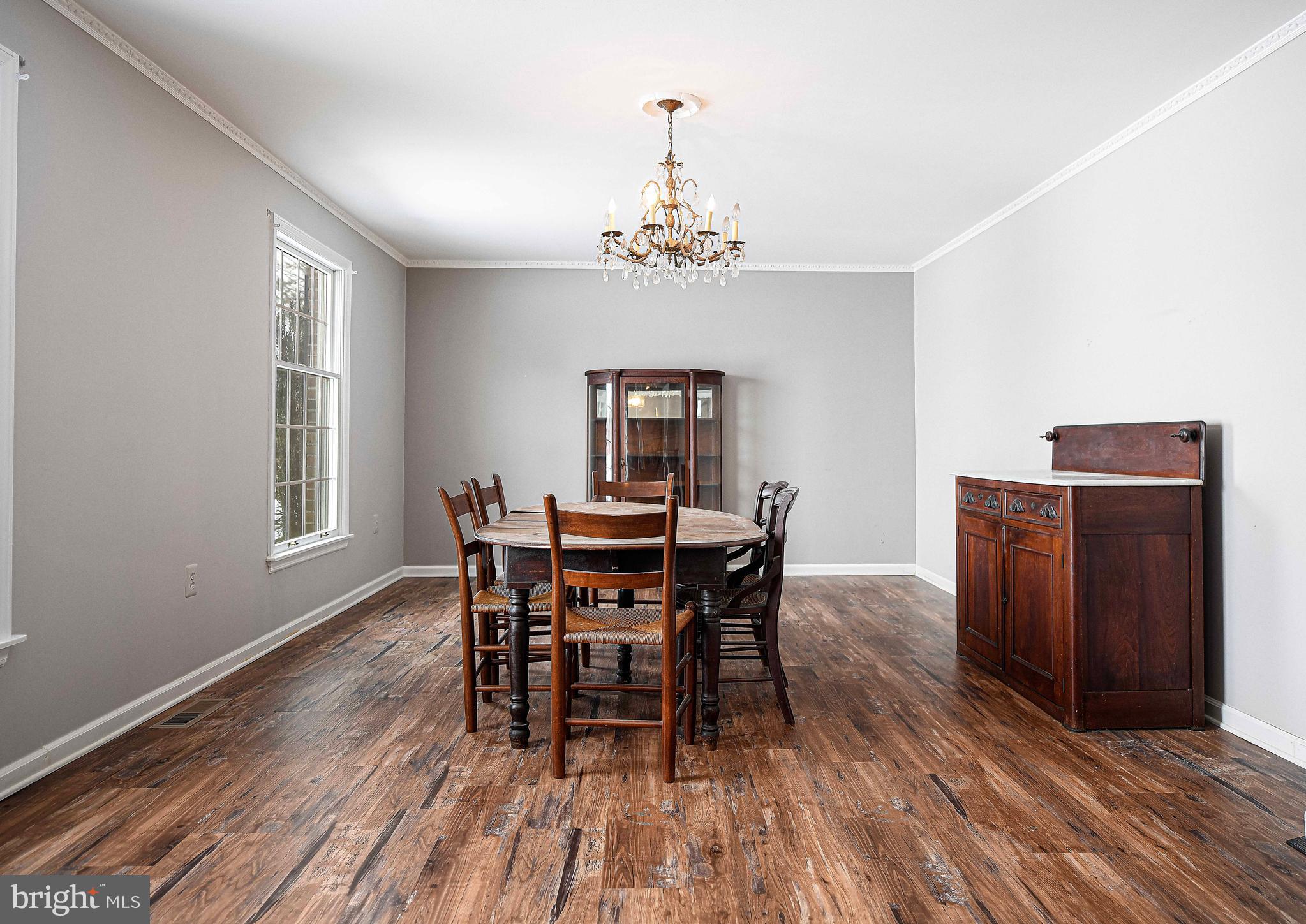 754 Main Street Fawn Grove, PA 17321 - Photo 11 of 40 a view of a dining room with furniture window and wooden floor