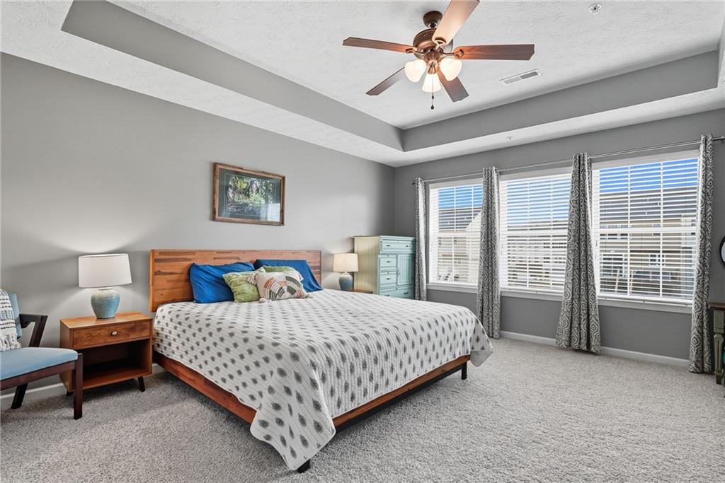 11 Truman Circle McKees Rocks, PA 15136 - Photo 20 of 33 a bedroom with a large bed chandelier and a window
