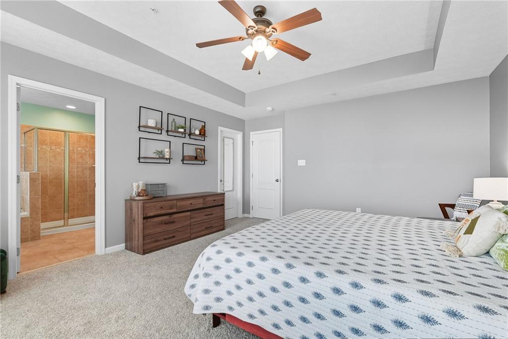 11 Truman Circle McKees Rocks, PA 15136 - Photo 21 of 33 a bedroom with a bed and a chandelier