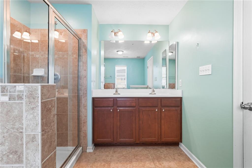11 Truman Circle McKees Rocks, PA 15136 - Photo 23 of 33 a bathroom with a double vanity sink and a mirror