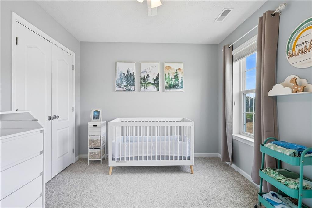 11 Truman Circle McKees Rocks, PA 15136 - Photo 25 of 33 a view of a bedroom with baby crib and a window