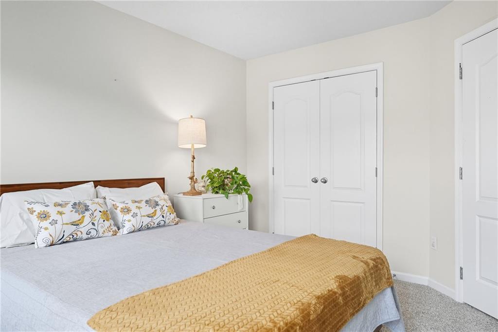 11 Truman Circle McKees Rocks, PA 15136 - Photo 27 of 33 a bedroom with a bed and a painting on the wall