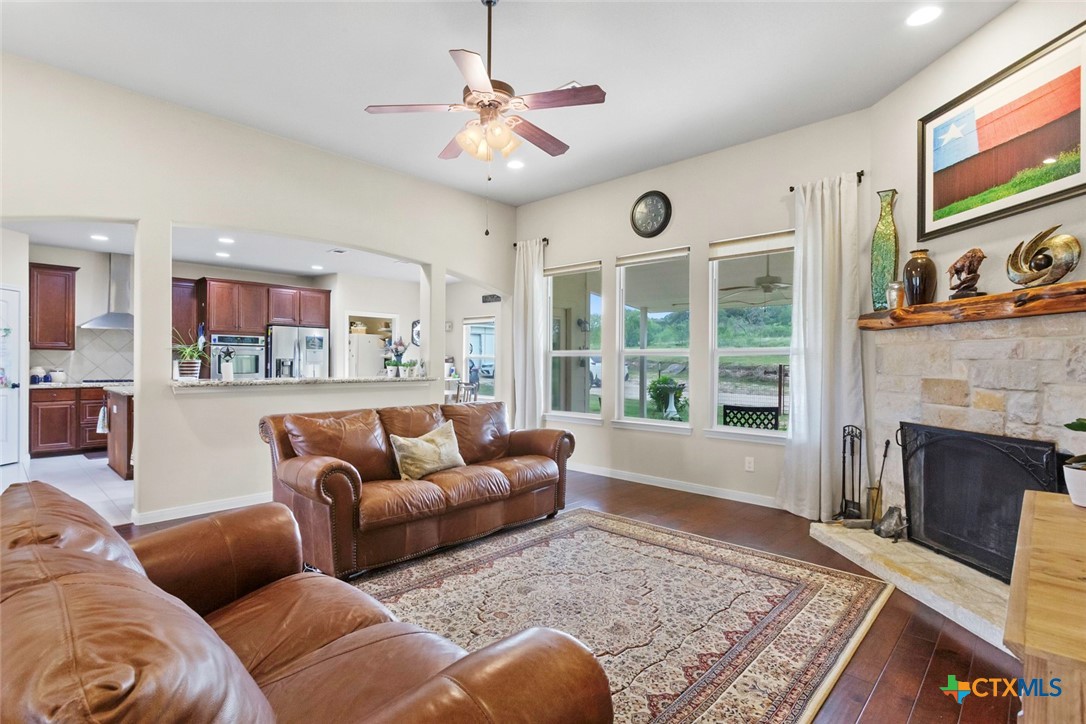 187 Tracks Trail Center Point, TX 78010 - Photo 16 of 41 a living room with furniture and a fireplace