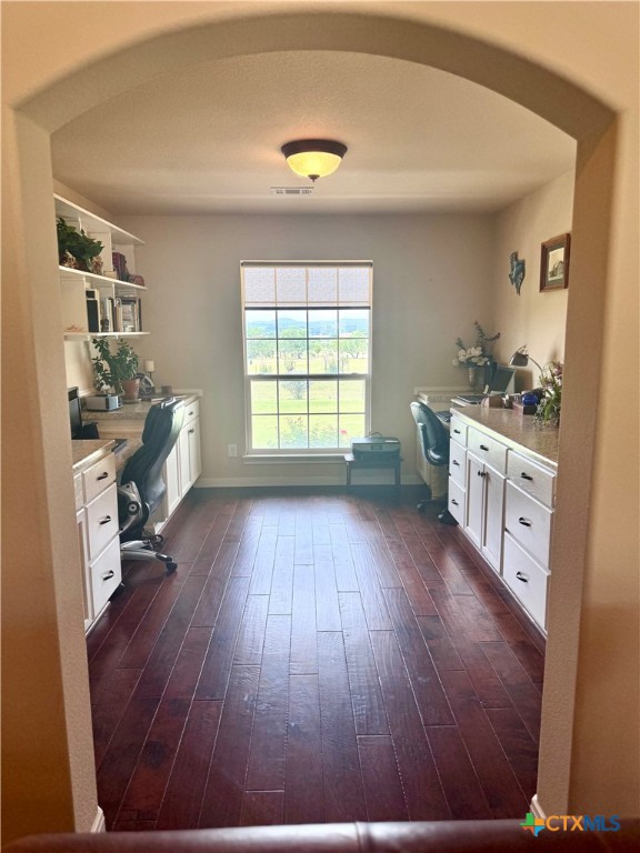 187 Tracks Trail Center Point, TX 78010 - Photo 19 of 41 a room with a bed and a wooden floor