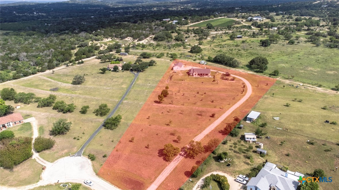 187 Tracks Trail Center Point, TX 78010 - Photo 2 of 41 a view of a swimming pool with a yard