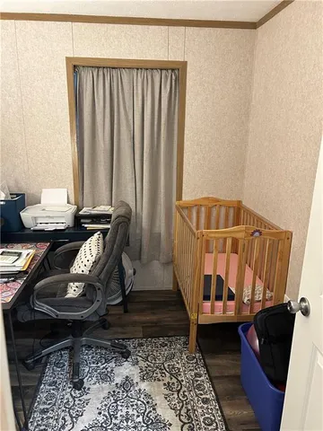 a bathroom with a toilet and a shower curtain