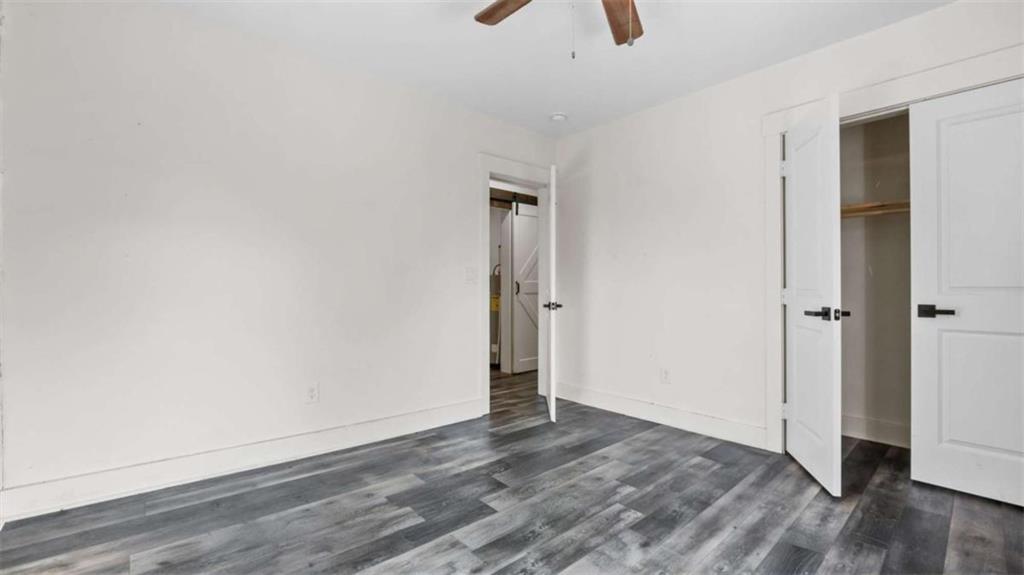 610 Madola Road, Unit 3 Epworth, GA 30541 - Photo 11 of 15 an empty room with wooden floor and closet