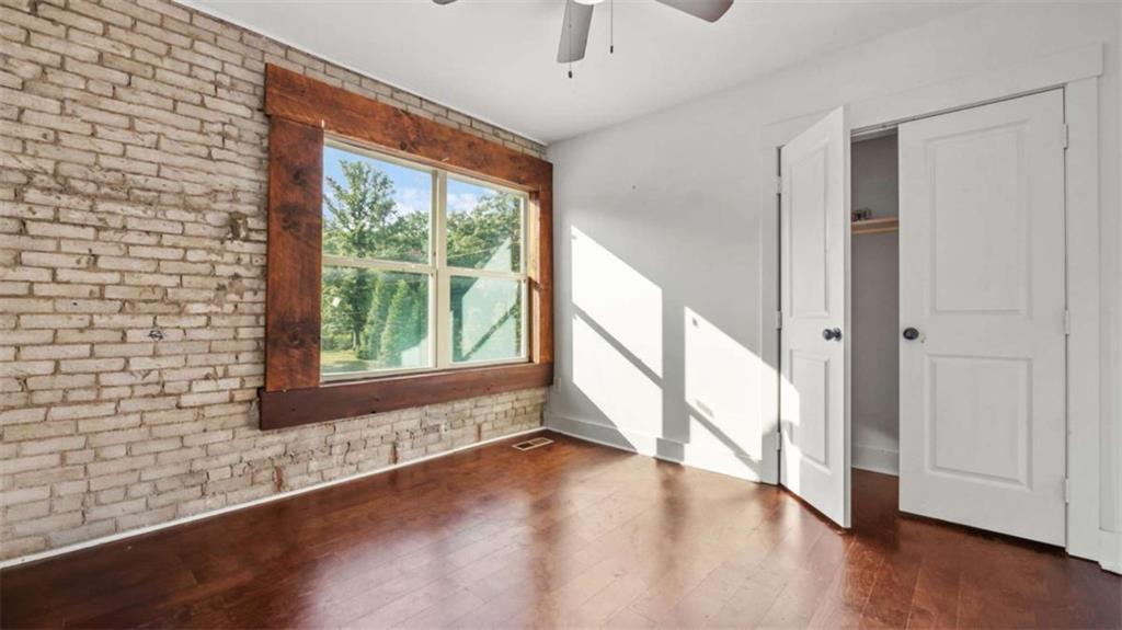 610 Madola Road, Unit 3 Epworth, GA 30541 - Photo 12 of 15 a view of an entryway with wooden floor and windows