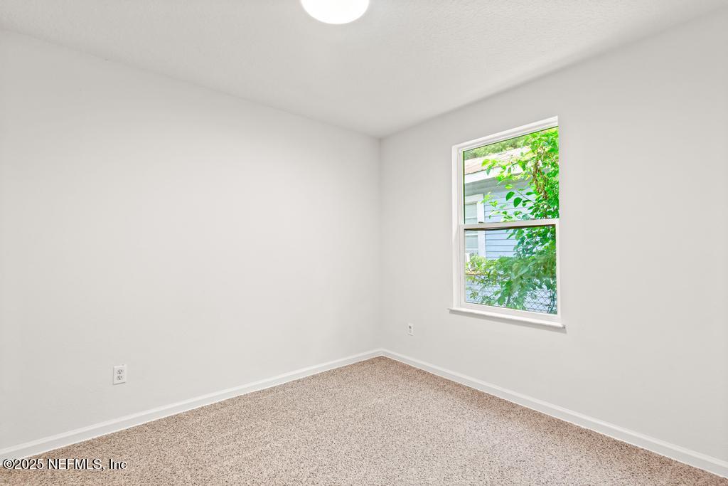 3701 Stuart Street Jacksonville, FL 32209 - Photo 12 of 24 an empty room with a window