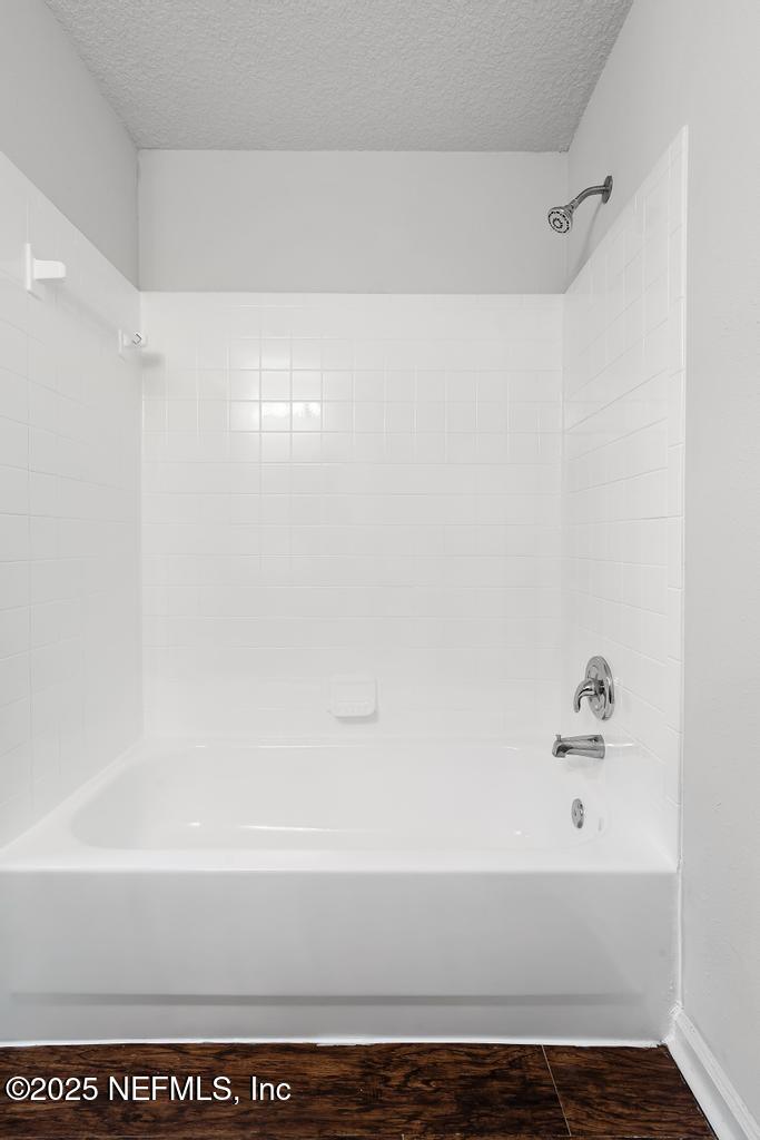 3701 Stuart Street Jacksonville, FL 32209 - Photo 22 of 24 a bathroom with a bathtub and shower