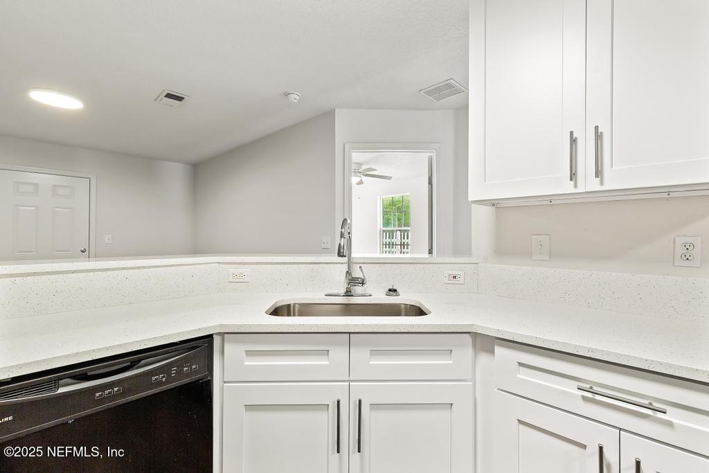 3701 Stuart Street Jacksonville, FL 32209 - Photo 8 of 24 a kitchen with a sink and cabinets