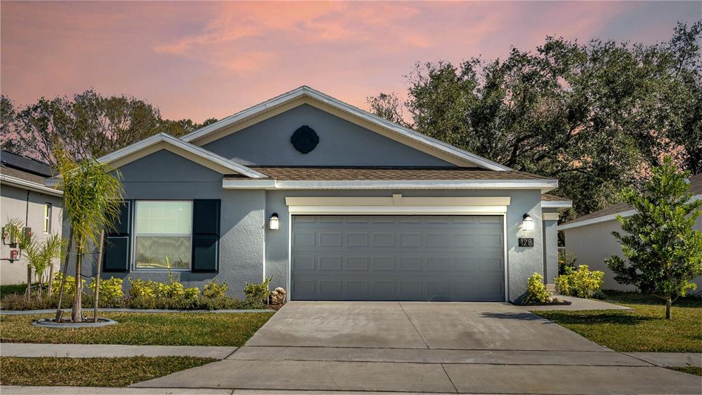 128 Pershing Street Bartow, FL 33830 - Photo 1 of 1 a front view of a house with a yard