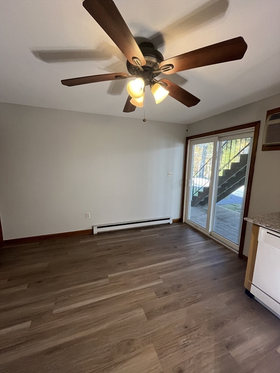 35 School Street, Unit 7 Dracut, MA 01826 - Photo 4 of 22 a view of an empty room with a ceiling fan and window