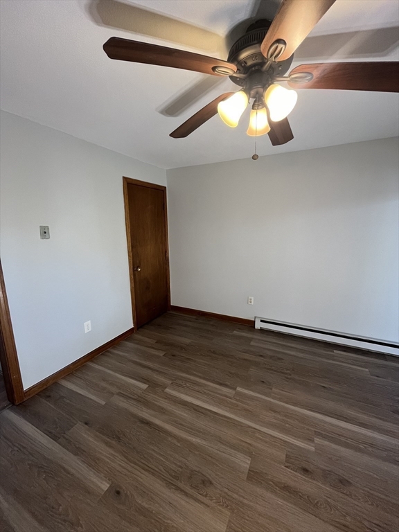 35 School Street, Unit 7 Dracut, MA 01826 - Photo 5 of 22 a view of empty room with wooden floor