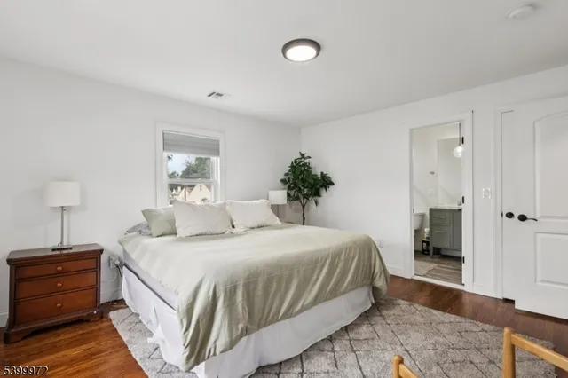 a bedroom with a bed and a closet