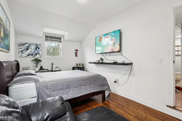 a bedroom with bed and a window