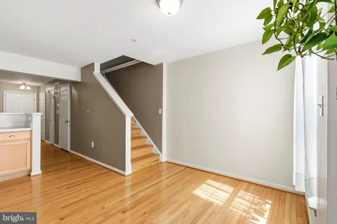 a view of an entryway with wooden floor