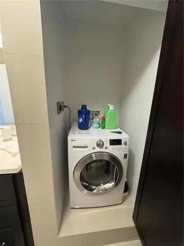 a bathroom with a sink vanity and mirror