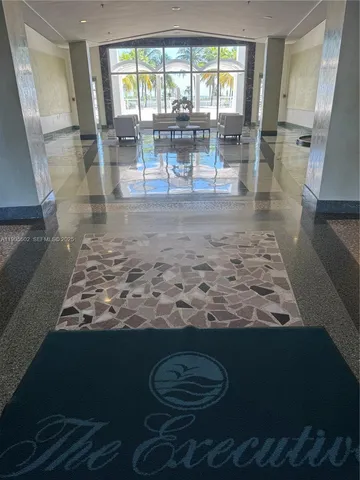 a view of a living room and dining room