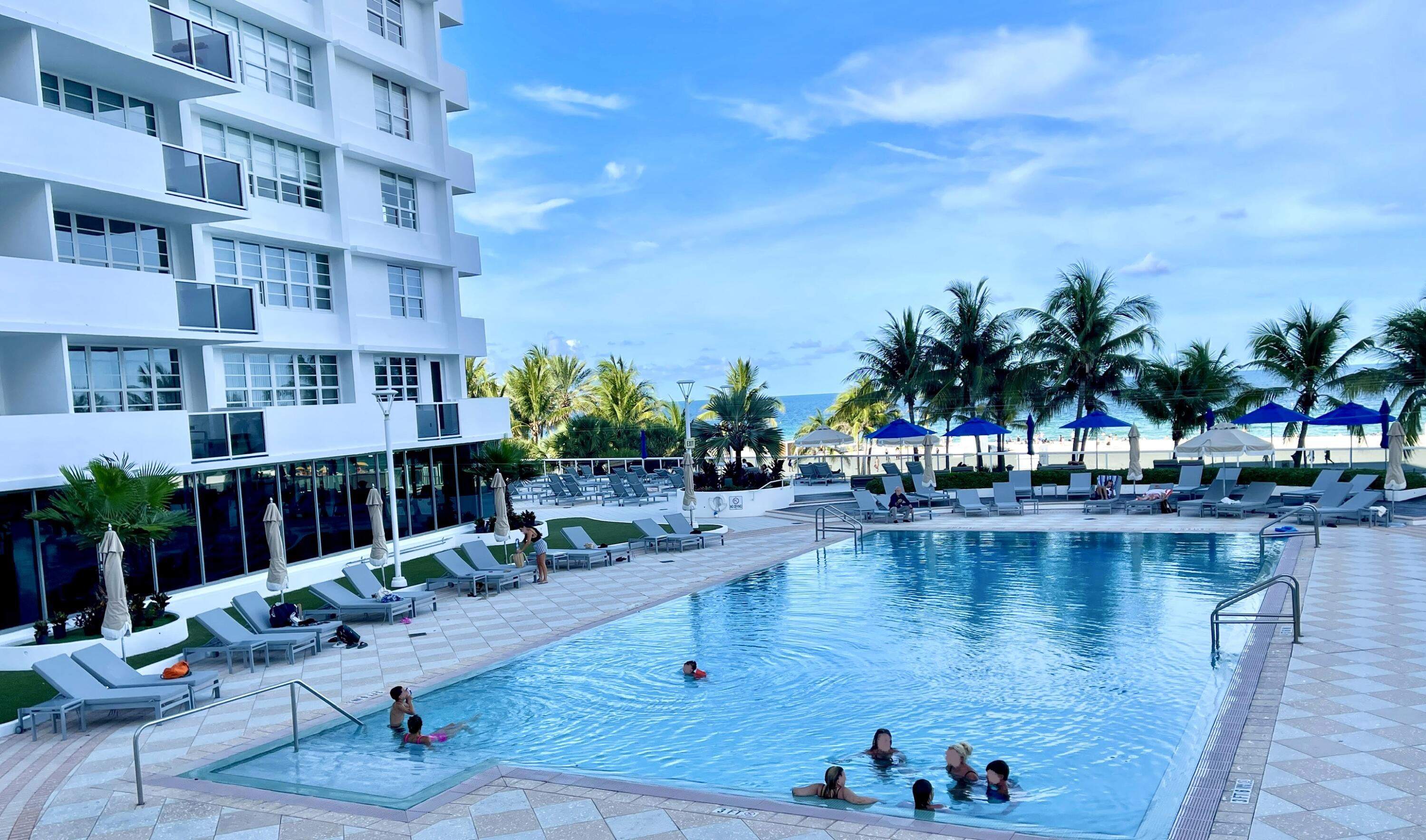 100 Lincoln Road, Unit 1105 Miami Beach, FL 33139 - Photo 13 of 30 a view of swimming pool with outdoor seating and plants