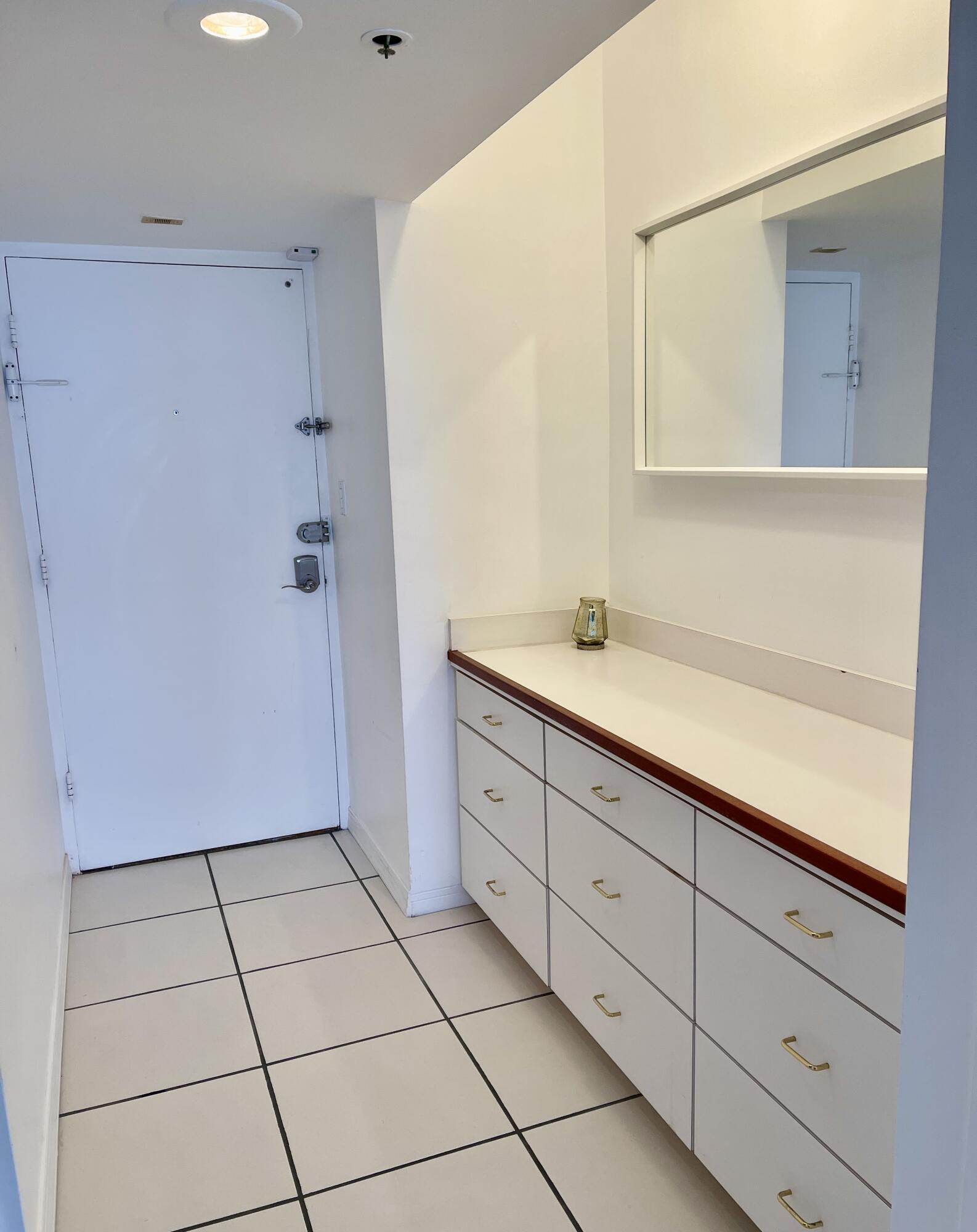 100 Lincoln Road, Unit 1105 Miami Beach, FL 33139 - Photo 17 of 30 a spacious bathroom with a sink a mirror and a shower