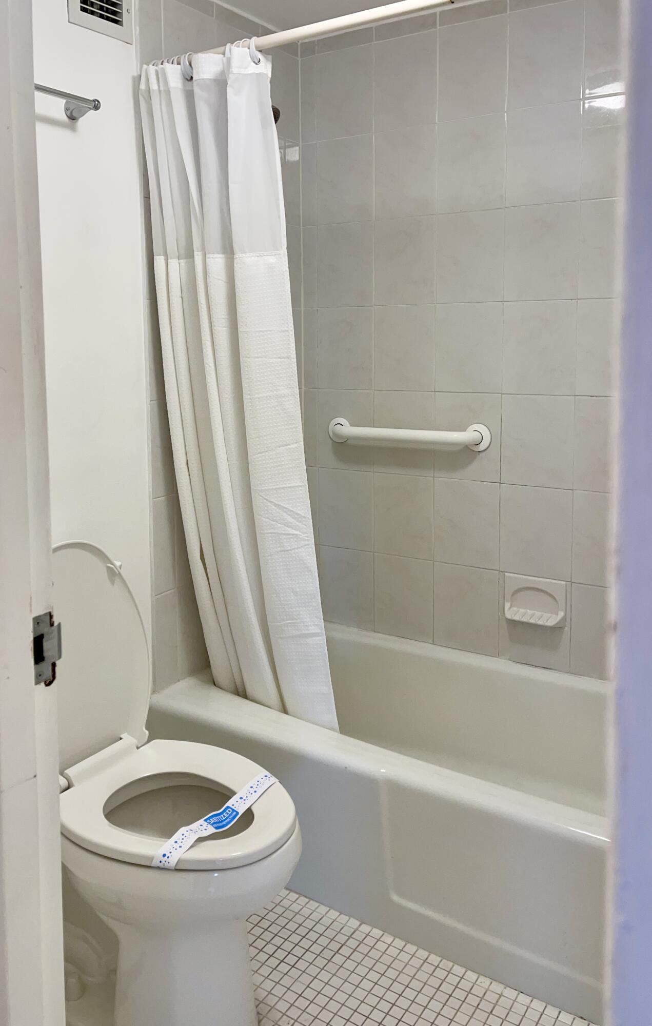 100 Lincoln Road, Unit 1105 Miami Beach, FL 33139 - Photo 21 of 30 a bathroom with a sink a toilet and tub