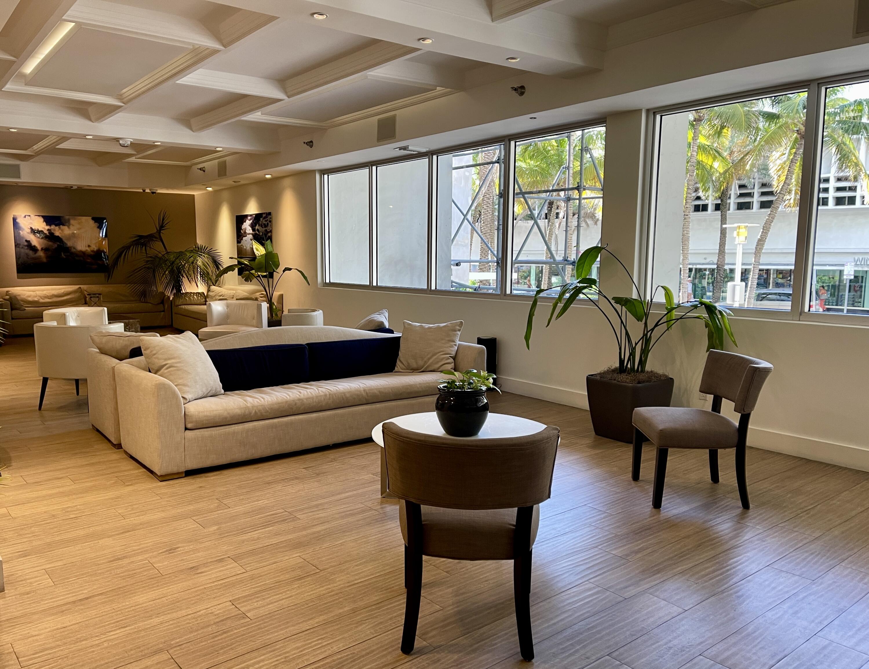 100 Lincoln Road, Unit 1105 Miami Beach, FL 33139 - Photo 8 of 30 a living room with furniture and a large window