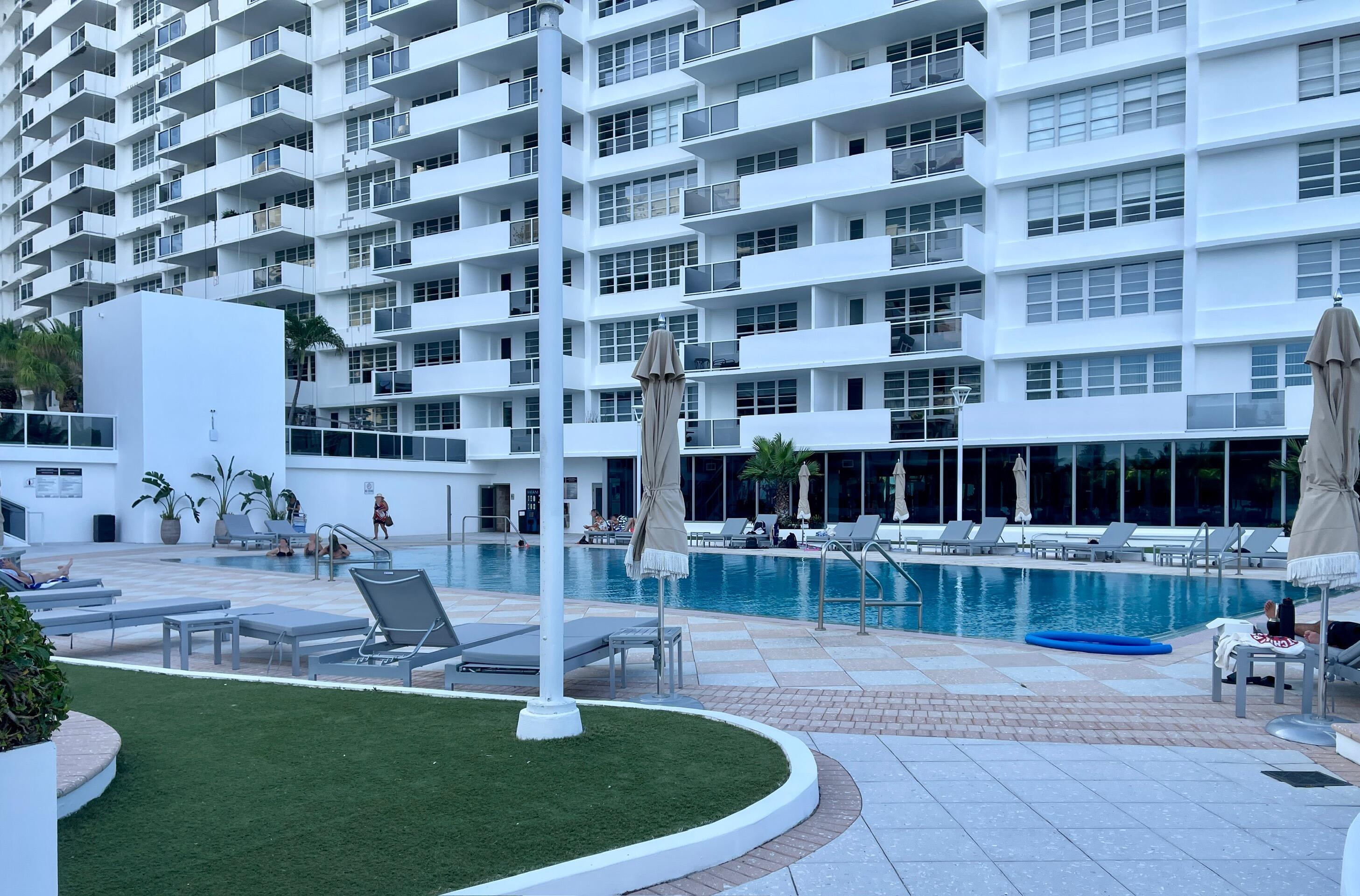 100 Lincoln Road, Unit 1105 Miami Beach, FL 33139 - Photo 9 of 30 a front view of a building with a garden