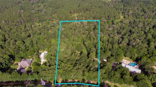 a view of a house with a tree