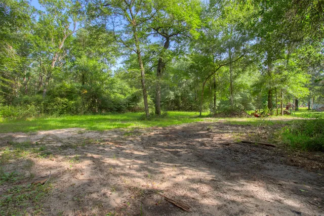 a view of outdoor space with deck and yard