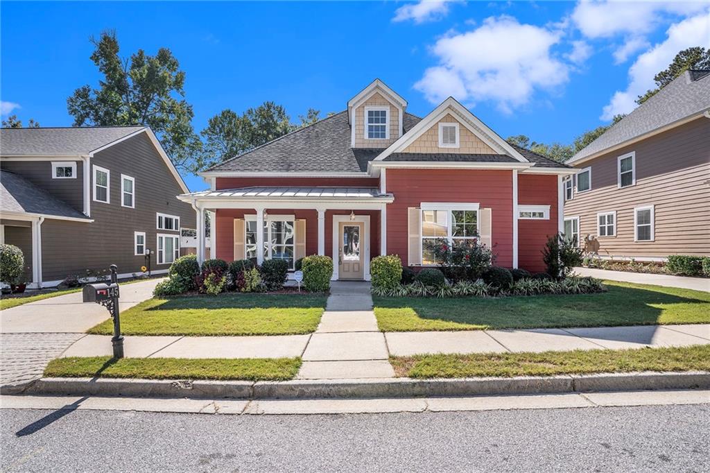 a front view of house with yard and green space