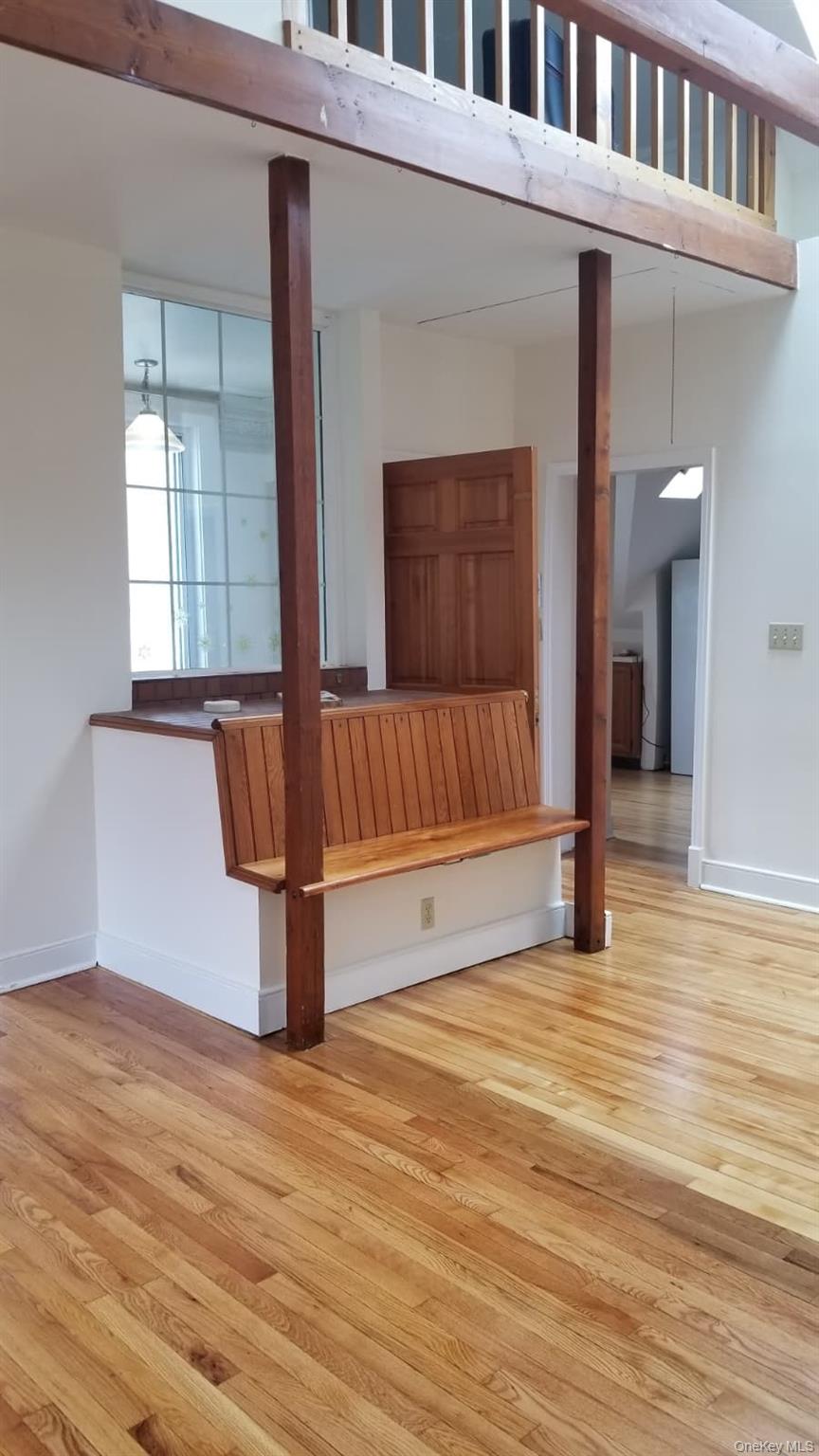 92 Roe Avenue, Unit 3 Highland Falls, NY 10928 - Photo 8 of 17 Living room with built in seating and pull down stairs loft space