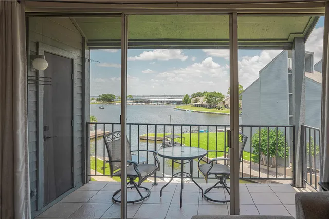 a view of a balcony with furniture