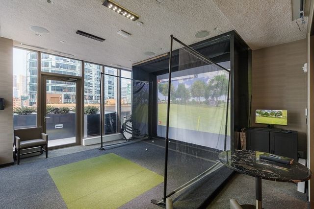 a terrace with a seating space and barbeque oven