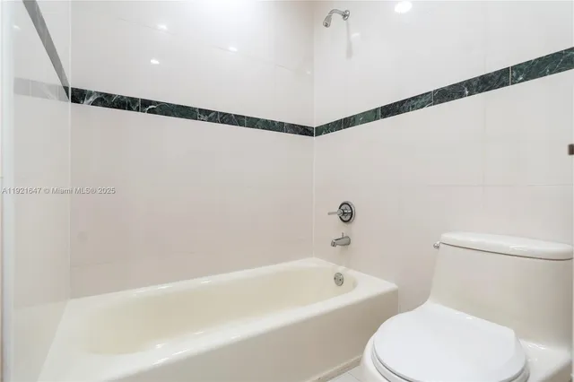 a view of a bathroom from the hallway