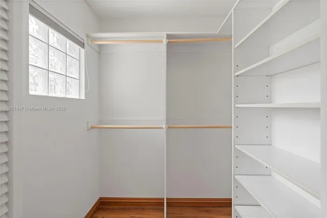 a bathroom with a shower and a glass door